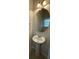 Powder room features a pedestal sink, decorative lighting, and a large mirror at 6941 Rogers Pt, Lithonia, GA 30058