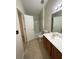 This full bathroom offers a tub and shower combination and a sleek, single sink vanity at 6941 Rogers Pt, Lithonia, GA 30058
