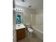 Bathroom with a tub and shower combination and single sink vanity at 6941 Rogers Pt, Lithonia, GA 30058