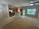 Eat in kitchen featuring stainless steel appliances and oak cabinets with a bar area and large windows at 6941 Rogers Pt, Lithonia, GA 30058