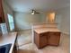 Bright eat-in kitchen with a view to a living room with a ceiling fan and lots of natural light at 6941 Rogers Pt, Lithonia, GA 30058