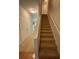 A carpeted staircase with white banister leads to the upper level of the home at 6941 Rogers Pt, Lithonia, GA 30058