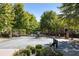 Gated entrance to the community with lush landscaping and a secure entry system for peace of mind at 2548 Crescent Park Ct # 7, Atlanta, GA 30339