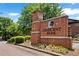 Elegant brick entrance sign to Crescent Park community with colorful flowers and manicured landscaping at 2548 Crescent Park Ct # 7, Atlanta, GA 30339