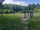 Fenced community dog park with a grassy area and mature trees, perfect for furry friends to roam at 2548 Crescent Park Ct # 7, Atlanta, GA 30339