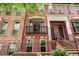Detailed view of brick townhomes, showcasing the front entrances, windows, and balcony details at 2548 Crescent Park Ct # 7, Atlanta, GA 30339