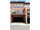 Stunning brick townhomes with private garages and balconies, enhanced by lush greenery at 2548 Crescent Park Ct # 7, Atlanta, GA 30339