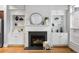 Close-up of the fireplace flanked by built-in shelving and decorative accents at 2548 Crescent Park Ct # 7, Atlanta, GA 30339