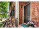 Inviting front entrance with brick facade, elegant door, and a 