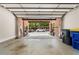 Open garage with exposed brick ceiling leading to the driveway outside at 2548 Crescent Park Ct # 7, Atlanta, GA 30339