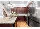 Spacious kitchen with wood cabinets, granite countertops, stainless steel appliances, and a functional center island at 2548 Crescent Park Ct # 7, Atlanta, GA 30339