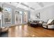 Comfortable living room with hardwood floors, fireplace, coffered ceilings, and access to a private balcony at 2548 Crescent Park Ct # 7, Atlanta, GA 30339