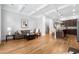 Open-concept living room with hardwood floors, coffered ceilings, and a seamless flow into the kitchen at 2548 Crescent Park Ct # 7, Atlanta, GA 30339
