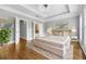 Main bedroom with hardwood floors, tray ceilings, and access to an ensuite bathroom at 2548 Crescent Park Ct # 7, Atlanta, GA 30339