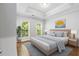 Comfortable main bedroom with tray ceilings, hardwood floors, and lots of natural light at 2548 Crescent Park Ct # 7, Atlanta, GA 30339