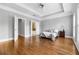 Spacious main bedroom featuring hardwood floors, tray ceilings, and access to the ensuite bathroom at 2548 Crescent Park Ct # 7, Atlanta, GA 30339