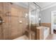 Tiled shower with glass door and built in seat adjacent to a soaking tub at 2548 Crescent Park Ct # 7, Atlanta, GA 30339
