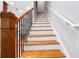 Elegant staircase with hardwood steps, iron balusters, and white risers, leading to the upper level at 2548 Crescent Park Ct # 7, Atlanta, GA 30339