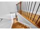 View from the top of staircase with hardwood steps, iron balusters, and white risers at 2548 Crescent Park Ct # 7, Atlanta, GA 30339