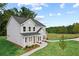 Gorgeous two-story home featuring gray siding, a manicured lawn, and an attractive exterior design at 410 Beacon Way Way, Villa Rica, GA 30180