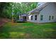 Large backyard perfect for activities, featuring a play area and a trampoline at 8145 Lakeview Pkwy, Villa Rica, GA 30180