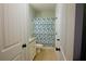 Bathroom featuring tile flooring, toilet, vanity, and shower with patterned shower curtain at 8145 Lakeview Pkwy, Villa Rica, GA 30180