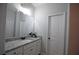 Bathroom featuring a granite countertop, vanity, mirror, and a closed white door at 8145 Lakeview Pkwy, Villa Rica, GA 30180