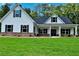 Charming new construction home featuring a manicured lawn and inviting front porch at 8145 Lakeview Pkwy, Villa Rica, GA 30180
