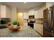 Modern kitchen with white cabinets, stainless steel appliances, and granite countertops at 8145 Lakeview Pkwy, Villa Rica, GA 30180