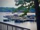 Lake view featuring boat docks and other watercraft docked on a sunny day at 8145 Lakeview Pkwy, Villa Rica, GA 30180