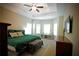 A spacious main bedroom with tray ceilings, a bay window, and a decorative rug at 8145 Lakeview Pkwy, Villa Rica, GA 30180