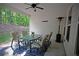 Covered patio area with outdoor furniture, ceiling fan, and view of the landscaped backyard at 8145 Lakeview Pkwy, Villa Rica, GA 30180