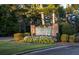 Stone sign at the entrance to Fairfield Plantation surrounded by landscaped flowers and shrubs at 8145 Lakeview Pkwy, Villa Rica, GA 30180