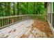 Wooden back deck surrounded by beautiful trees at 8607 Wood Springs Ct, Douglasville, GA 30135