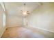Large bedroom with neutral carpeting, vaulted ceilings, and ample natural light at 8607 Wood Springs Ct, Douglasville, GA 30135
