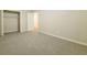 Bedroom with neutral carpet, a closet, and access to a door at 8607 Wood Springs Ct, Douglasville, GA 30135
