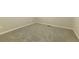 Angle view of a bedroom with neutral carpet and baseboards at 8607 Wood Springs Ct, Douglasville, GA 30135