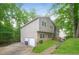 Well-maintained home with siding, stone accents, two-car garage and a neatly kept lawn at 8607 Wood Springs Ct, Douglasville, GA 30135