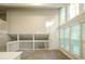 Spacious room with tile flooring, storage area, and lots of natural light from the many windows at 8607 Wood Springs Ct, Douglasville, GA 30135