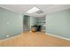 The basement office space features wood-look flooring, and built-in shelving at 503 Fable Ln, Canton, GA 30114