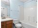 Bathroom featuring a single sink vanity and a tub with shower at 503 Fable Ln, Canton, GA 30114