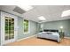 Bedroom features wood-look floors, and a glass door that lets in natural light at 503 Fable Ln, Canton, GA 30114