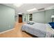 Bedroom with neutral colored walls and a large bed with view to exterior door at 503 Fable Ln, Canton, GA 30114