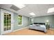 Cozy bedroom with a door to the outside and a bright window with a view to the trees at 503 Fable Ln, Canton, GA 30114