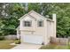 Charming two-story home featuring an attached garage and well-maintained front yard at 503 Fable Ln, Canton, GA 30114