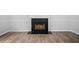 Living room showcasing a fireplace and modern flooring at 503 Fable Ln, Canton, GA 30114