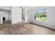 Open concept living room with wood flooring, fireplace, and natural light at 503 Fable Ln, Canton, GA 30114