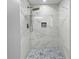 Walk-in shower features marble tile and modern fixtures, creating a spa-like experience at 5142 Golfbrook Ct, Stone Mountain, GA 30088