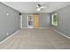 An airy bedroom is brightened by natural light and features a stylish barn door at 5142 Golfbrook Ct, Stone Mountain, GA 30088