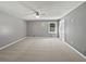 A spacious bedroom is brightened by natural light, complemented by a ceiling fan at 5142 Golfbrook Ct, Stone Mountain, GA 30088